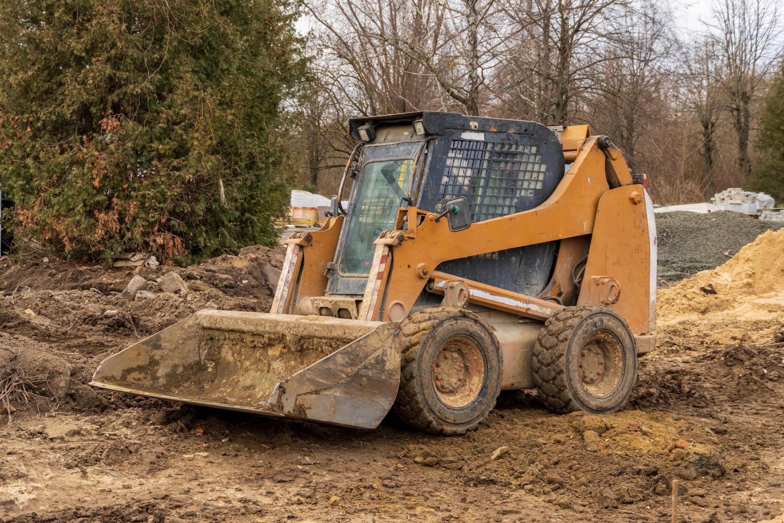 Excavation machinery preparing ground before concrete work