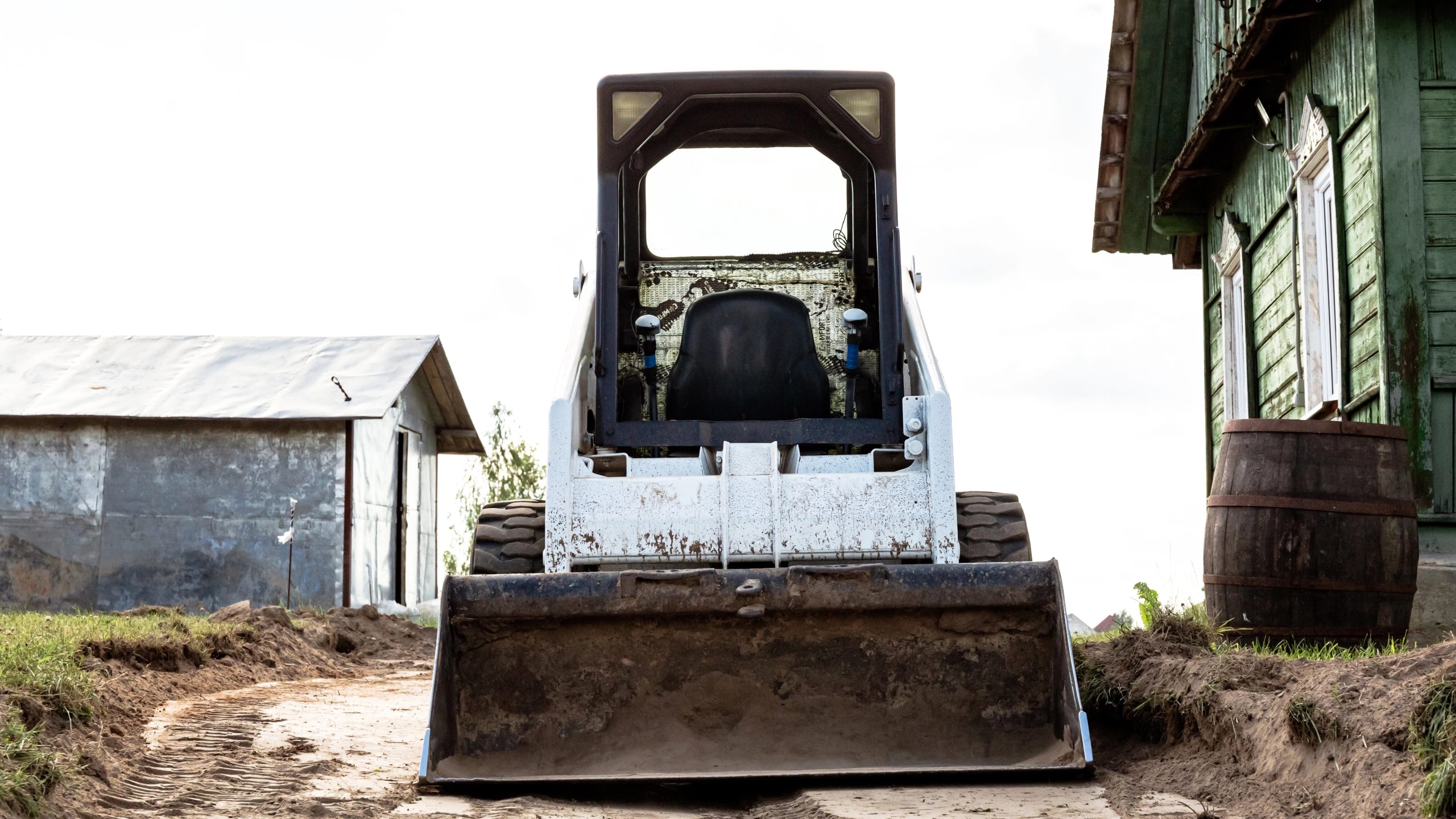 Skid steer working on a rural access track